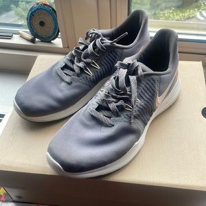 Gently worn Nike woman’s running shoes grey in color size 7
